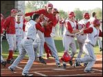  St. Francis celebrates as Mark Phillips (6) scores to defeat Whitmer in a Division I district semfinal.