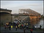  A portion of the Interstate-5 bridge is submerged after it collapsed into the Skagit river dumping vehicles and people into the water Thursday in Mount Vernon, Wash.