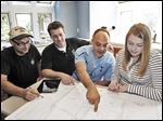  Tim Brandvold, left, and Scot Waggoner show plans for a kitchen remodel to Chris and Jen Romans in Minneapolis. Experts advise homeowners to be sure contractors are licensed to do the job.