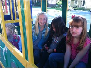 From right to left is Ava Hess, Layla Kajfasz, and Ava Lewis who are all riding the train during the Perrysburg Alternative to Substance Abuse event in downtown Perrysburg Friday.