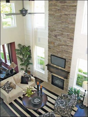 The dramatic stone fireplace rises two stories in the great room.  