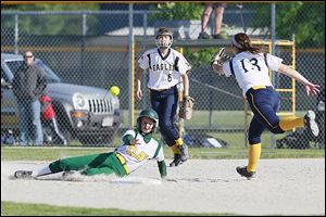Hayley Schiavone scores for Clay in the second inning against Notre Dame  catcher Emily Novak in a Division I district final.