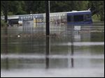 A San Antonio metro bus sits in floodwaters after it was swept off the road.