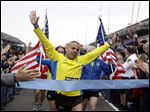  Joe Briseno, of Springfield Ill., leads a group of the approximately 35 runners from the 2013 Boston Marathon, that were unable to finish the race due to the tragic bombings, to complete the distance by crossing finish line at the Indianapolis Motor Speedway before the start of the 97th Indianapolis 500 auto race. 