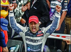 Tony Kanaan celebrates winning the Indianapolis 500 for the first time. His previous best finish was in 2004, when he finished second.