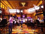  Patrons play table games during the Hollywood Casino one year anniversary celebration.