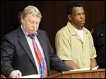  Benjamin James Besteder, Jr., right, stands with his attorney public defender James MacHarg, left, during his arraignment for the shooting at Robinson Park at the Toledo Municipal Court today.