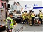  Emergency responders gather at a mock crash in Columbus in April. Ohio is taking advantage of a Federal Highway Administration program to train thousands of police, firefighters, tow-truck drivers, coroners, and others to clear highway crash scenes safely and efficiently. Ohio is among about 20 states using the program.