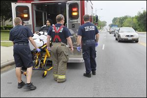 Authorities put Dorian Hester, 19, into an ambulance after a shooting on the corner of Evans and South Cove Blv.