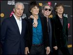  (L to R) Charlie Watts, Ronnie Wood, Keith Richards and Mick Jagger of the Rolling Stones pose for photos on their way into the Ziegfeld Theater to view 
