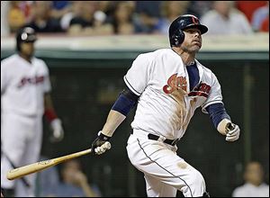 The Indians' Jason Giambi watches his three-run home run off the Reds' Bronson Arroyo in the sixth inning. It stretched Cleveland's lead to 5-1 as the Indians ended their five-game losing streak.