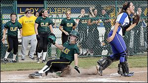 Clay's Brooke Gyori scores the game-winning run off a hit by Lindsay Schiavone in the seventh inning while Anthony Wayne’s Kayley Corcoran waits for the throw in a Division I regional semi.