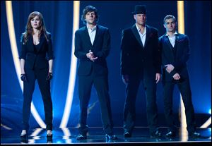 Isla Fisher, Jesse Eisenberg, Woody Harrelson and Dave Franco in a scene from 