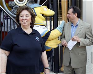 Linda Greene, president of ISOH/IMPACT, and Joe Napoli, president and general manager of the Mud Hens and Walleye say their respective organizations will work together to collect disaster relief supplies in a year-round program.