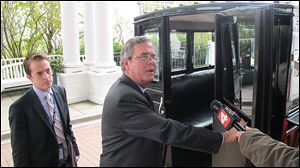 Former Florida Gov. Jeb Bush prepares to board a carriage after delivering a speech at the Mackinac Policy Conference on Mackinac Island this week.