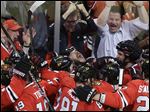  Chicago Blackhawks defenseman Brent Seabrook, center, looking up, celebrates with his teammates after scoring during the overtime in Game 7 of the NHL hockey Stanley Cup Western Conference semifinals against the Detroit Red Wings Wednesday.
