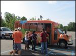  Departing on the Lourdes shuttle is the study abroad group. 
