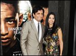  Director M. Night Shyamalan and his wife Bhavna attend the 
