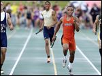  Malcolm Johnson runs the final leg to help Southview win the 800-meter relay at the Division I regional track meet.