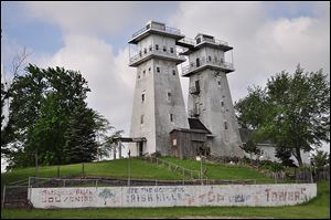 The Irish Hills Towers were run as a popular tourist attraction in Lenawee County until 1999; now, the twin structures are in danger of falling onto the road.