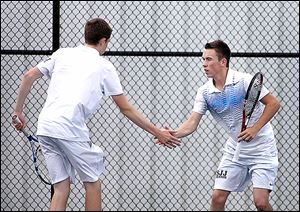 St. John's sophomore Kevin Brown, left, celebrates a point with his brother Ryan in a Division I state doubles match.