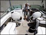  Perrysburg resident Ken Walters cleans his 24-foot Four Winds boat last week at Pier 75 Dry Rack Marina. 