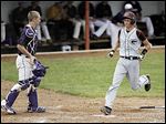  Genoa junior Luke Rightnowar scores in the  fourth inning of the Division III regional final against Bloom-Carroll. The Comets finished 20-10 without a senior on the roster.