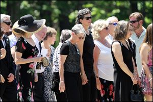 Family and friends arrive for a memorial service for Nancy Lanza today in Kingston, N.H.  