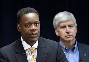 Emergency manager Kevyn Orr, left, and Michigan Gov. Rick Snyder have said they don’t want to plunder the museum’s vaults, but all city property must be identified for the people to whom the city is in debt.
