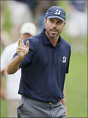 Matt Kuchar reacts after a birdie on the fourth hole during the third round.