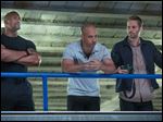  Dwayne Johnson , left, Vin Diesel, center, and Paul Walker star in 'Fast & Furious 6.'