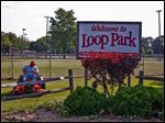  Tom Welsh cuts grass in Loop Park in Walbridge.  The park will be the scene of many of the village's centennial celebration events including the biggest event July 4-6 and a vintage baseball game Aug. 10.
