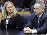  In this March court hearing are Detroit officer Joseph Weekely, right, and A&E producer Allison Howard, who was at the raid.