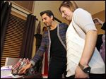  Scott Disick, left, and Josie Langsdorf, right, a Monclova Township woman with terminal cancer, cuts a cake with Disick's picture on it on January 15, 2013.