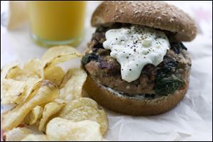 A Greek-style turkey burger with pepperoncini sauce.