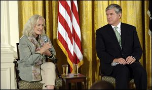 Actress Glenn Close, left, sitting next to National Association of Broadcasters President Gordon Smith, right, speaks about her family's struggles with mental illness.