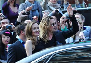 Angelina Jolie and Brad Pitt arrive at the World Premiere of 'World War Z' in London on Sunday. 