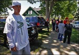 Terry Steinfurth talks about his missing daughter, 1½-year-old Elaina Steinfurth, as he and family and friends converge on the corner of Federal and Leonard streets in East Toledo.
