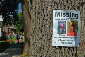Flyers for missing child Elaina Steinfurth, 1½, are posted around Federal Street, where the toddler was last seen.