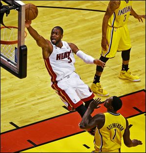 Miami's Dwyane Wade, who had 21 points, soars to the basket against Indiana's Lance Stephenson in Game 7 of the Eastern Conference finals. The Heat will face San Antonio in the NBA Finals.