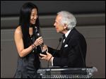  Designer Vera Wang, left, is presented with an award by fellow designer Ralph Lauren at  the 2013 CFDA Fashion Awards at Alice Tully Hall on Monday in New York.
