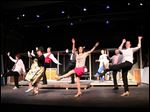  The cast members of 'The Drowsy Chaperone' kick up their heels in a dance number from the production that opens this weekend at the Toledo Repertoire Theatre, 16 10th St.