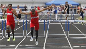 Eastwood’s Joey Salinas, left, and Devin Snowden race in the 300-meter hurdles at the Northern Buckeye Conference meet. Snowden won the event at the Division II regional and ran on two winning relays.