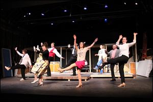 The cast members of 'The Drowsy Chaperone' kick up their heels in a dance number from the production that opens this weekend at the Toledo Repertoire Theatre, 16 10th St.