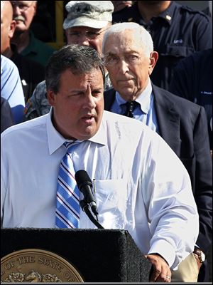 U.S. Sen. Frank Lautenberg, right, (D., N.J.), listens as New Jersey Gov. Chris Christie addresses a gathering in Lincoln Park, N.J., in 2011.