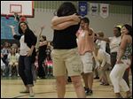  Parent Jessica Brutlag, of Sylvania, left, and her fellow dancers stuck a pose at the finale of their parental flash mob at the conclusion of fifth grade graduation at Central Trail Elementary.