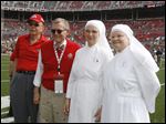  Left to right Stan Joehlin,  Ohio State president Gordon Gee, along with Little Sisters of the Poor Sr. Cecilia Sartorius and Sr. Margaret Banar prior to the football game against Toledo Saturday, 09/10/11, in Columbus, Ohio.