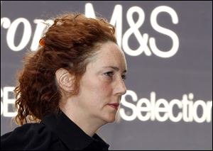 Former News International chief executive Rebekah Brooks arrives at a court in London, today, to enter a plea to charges related to phone hacking.