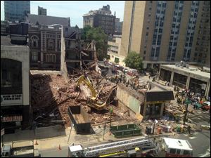Emergency personnel respond to a building collapse in downtown Philadelphia.