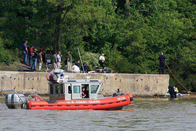 A-Coast-Guard-boat-cruises-slowly-up-the-Maumee-River-as-Toledo
